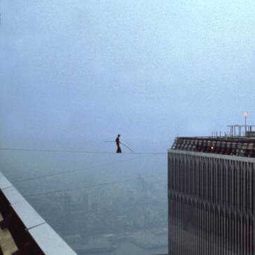 Philippe Petit walks between the Twin Towers